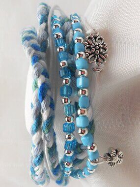 Handmade bracelet with rows of threads, beads, and charms No.240